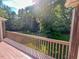 Outdoor deck with view of wooded backyard at 5500 Fortunes Ridge Dr # 94C, Durham, NC 27713