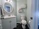 Bathroom featuring a vanity, tiled floors, toilet, and round mirror at 5500 Fortunes Ridge Dr # 94C, Durham, NC 27713