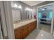 Bathroom featuring a dual vanity with granite countertop and access to the bedroom at 5500 Fortunes Ridge Dr # 94C, Durham, NC 27713