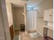Bathroom with shower, storage cabinet, tile floors and a dark wood vanity at 5500 Fortunes Ridge Dr # 94C, Durham, NC 27713