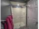 View of the shower featuring a glass door and white tiling at 5500 Fortunes Ridge Dr # 94C, Durham, NC 27713