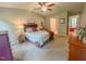 Spacious bedroom featuring carpet, neutral walls, ceiling fan, and walk-in closet at 5500 Fortunes Ridge Dr # 94C, Durham, NC 27713