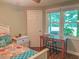 Well-lit bedroom featuring a desk and ample natural light from the window at 5500 Fortunes Ridge Dr # 94C, Durham, NC 27713