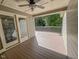 Spacious outdoor deck with ceiling fan, overlooking trees and yard at 5500 Fortunes Ridge Dr # 94C, Durham, NC 27713