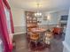 Cozy dining room featuring hardwood floors, natural lighting, and a built-in hutch at 5500 Fortunes Ridge Dr # 94C, Durham, NC 27713