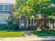 Well-maintained brick townhome with lush green lawn and mature trees providing shade and beauty at 5500 Fortunes Ridge Dr # 94C, Durham, NC 27713
