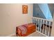 Hallway with carpet, painted handrail, and chest with decor at 5500 Fortunes Ridge Dr # 94C, Durham, NC 27713