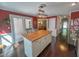 Spacious kitchen with an island, white cabinets, and hardwood floors at 5500 Fortunes Ridge Dr # 94C, Durham, NC 27713