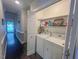Convenient laundry room area with washer, dryer and plenty of storage shelving space at 5500 Fortunes Ridge Dr # 94C, Durham, NC 27713