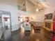 Spacious living room with high ceilings, a fireplace, hardwood floors, and abundant natural light at 5500 Fortunes Ridge Dr # 94C, Durham, NC 27713