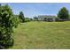 Expansive backyard, perfect for outdoor activities, features lush green grass, mature trees and room for a pool at 56 Sugarhill Dr, Zebulon, NC 27597