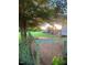 Spacious backyard with mature trees provides ample shade and privacy at 56 Sugarhill Dr, Zebulon, NC 27597