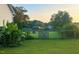Expansive backyard features mature trees, a secure fence, and an open grassy area at 56 Sugarhill Dr, Zebulon, NC 27597