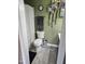Bathroom featuring a toilet, patterned shower curtain, tile flooring, and decor at 56 Sugarhill Dr, Zebulon, NC 27597