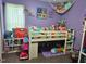 Playful bedroom featuring a lofted bed, stuffed animals, and creative decor at 56 Sugarhill Dr, Zebulon, NC 27597