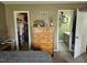 Bedroom featuring a dresser and access to a walk-in closet and bathroom at 56 Sugarhill Dr, Zebulon, NC 27597