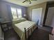 Bedroom with a ceiling fan and ample natural light from the large window at 56 Sugarhill Dr, Zebulon, NC 27597