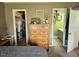Bedroom featuring a dresser between a walk-in closet and a bathroom at 56 Sugarhill Dr, Zebulon, NC 27597