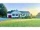 Charming single-story home with a well-maintained lawn and inviting curb appeal at 56 Sugarhill Dr, Zebulon, NC 27597