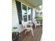 Inviting front porch features seating, perfect for relaxing outdoors at 56 Sugarhill Dr, Zebulon, NC 27597