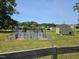 Backyard garden with raised metal beds, shed, and ample room to grow vegetables at 56 Sugarhill Dr, Zebulon, NC 27597