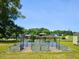 Large garden area with raised metal beds, ideal for growing vegetables and flowers at 56 Sugarhill Dr, Zebulon, NC 27597