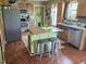 Well-equipped kitchen with stainless steel appliances, an island with seating, and wooden cabinets at 56 Sugarhill Dr, Zebulon, NC 27597