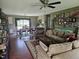 Open-concept living room and dining area with hardwood floors is perfect for entertaining at 56 Sugarhill Dr, Zebulon, NC 27597