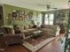 Cozy living room features hardwood floors, comfortable sofas, and a warm, inviting atmosphere at 56 Sugarhill Dr, Zebulon, NC 27597
