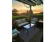 Outdoor patio space with comfortable seating under a pergola, ideal for relaxation at 56 Sugarhill Dr, Zebulon, NC 27597