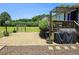 Paver patio features a grill and lush surrounding greenery perfect for outdoor living at 56 Sugarhill Dr, Zebulon, NC 27597