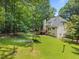 Spacious backyard with lush green grass and wooden structure at 6001 Waters Way Dr, Raleigh, NC 27606