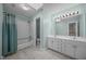 Bathroom featuring double vanity sinks, bathtub, and a separate shower at 6001 Waters Way Dr, Raleigh, NC 27606