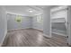 This bedroom features wood-look floors and neutral walls at 6001 Waters Way Dr, Raleigh, NC 27606