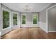 Dining room with many windows and elegant modern lighting at 6001 Waters Way Dr, Raleigh, NC 27606