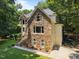 Home exterior showcasing the stone facade and a side-entry garage at 6001 Waters Way Dr, Raleigh, NC 27606