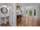 Spacious eat-in kitchen with a large island, white cabinetry, hardwood floors and backyard views at 6001 Waters Way Dr, Raleigh, NC 27606