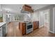Kitchen island with a built-in stove and a view of the living area at 6001 Waters Way Dr, Raleigh, NC 27606