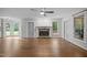 Bright living room with fireplace and access to a deck or patio at 6001 Waters Way Dr, Raleigh, NC 27606