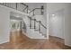 Beautiful staircase featuring dark wood accents and white railings at 6001 Waters Way Dr, Raleigh, NC 27606