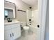 This bathroom features a white vanity, stylish black fixtures, and a shower-tub combo at 608 A E Umstead, Durham, NC 27701
