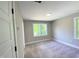 Neutral bedroom featuring two large windows that provide lots of natural light at 608 A E Umstead, Durham, NC 27701