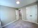 Bedroom featuring neutral walls, carpet, and a double door closet at 608 A E Umstead, Durham, NC 27701