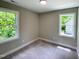 Bright bedroom with windows offering natural light and views of lush greenery at 608 A E Umstead, Durham, NC 27701