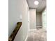 Upstairs hallway with neutral carpet, white trim, and access to multiple rooms at 608 A E Umstead, Durham, NC 27701
