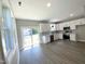 Modern kitchen featuring white cabinets, stainless steel appliances, and gray subway tile backsplash at 608 A E Umstead, Durham, NC 27701