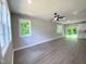 Bright, open living room featuring modern flooring, neutral walls, and large windows for natural light at 608 E Umstead St, Durham, NC 27701