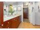 Bathroom with double sink vanity, stone countertops, and walk-in closet at 618 N Boylan Ave # 520, Raleigh, NC 27603