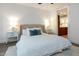 Cozy bedroom with upholstered headboard, side tables, lamps, and soft rug at 618 N Boylan Ave # 520, Raleigh, NC 27603