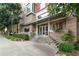 Exterior view of building entrance featuring a modern design and well-manicured landscaping at 618 N Boylan Ave # 520, Raleigh, NC 27603